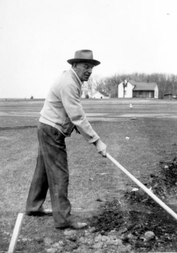 Joe Meuwissen working on ball park located at St. Hubert's Parish. circa 1947