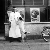 Joe Meuwissen (proprietor)  in front of Joe's Tavern in 1940's