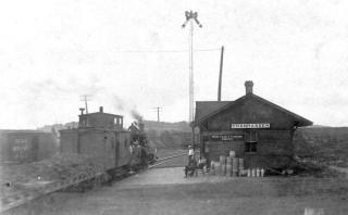 Chanhassen Train Depot. Shipping empty kegs of beer to brewery.