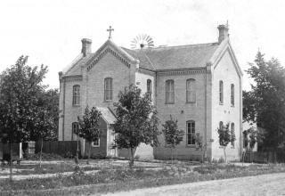 St. Hubert's School showing wind mill in background. Circa 1910