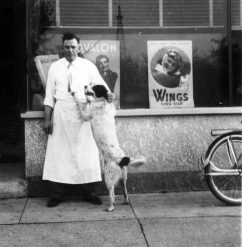 Joe Meuwissen (proprietor)  in front of Joe's Tavern in 1940's