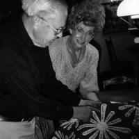 Vicotria (vogel) Rademacher admiring St. Hubert's "The Name Quilt".