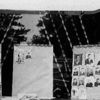 WWII photos of service men on display at Pauly's store - 1945