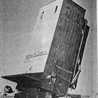 The toppling of the Chanhassen grain elevator - circa unknown