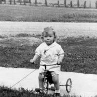 Howard Meuwissen on his tricycle - circa 1936