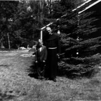 Fr. Herbert Diethelm, pastor at St. Hubert's with Craig Bongard - 1953
